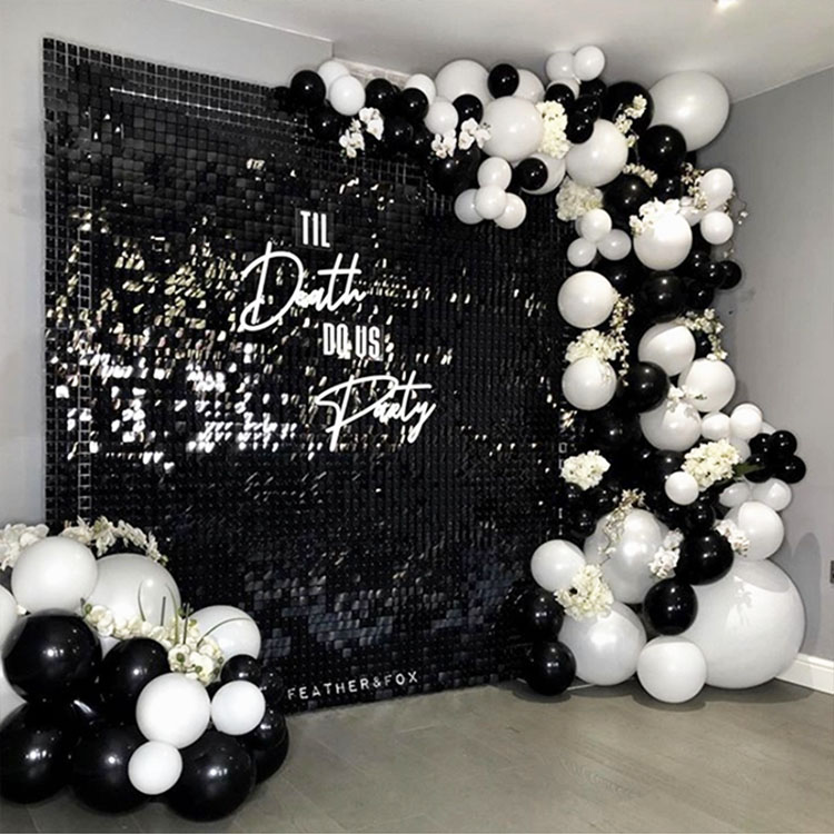 Black Shimmer wall rental in Atlanta with neon sign rental and black and white ballons .