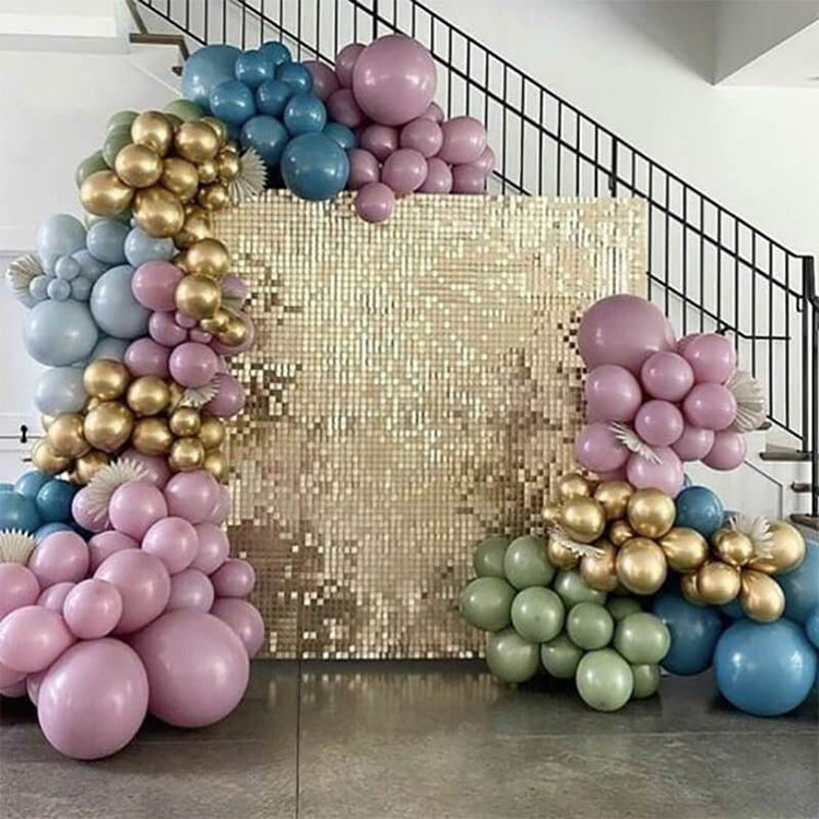 Shimmer Wall Rental in gold with multi colored ballon garlands.