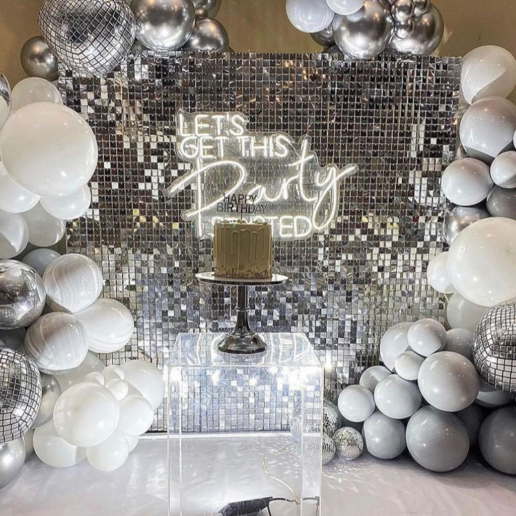 Silver shimmer wall rental with neon sign rental and Ballons.